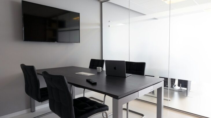 a table with chairs and a television