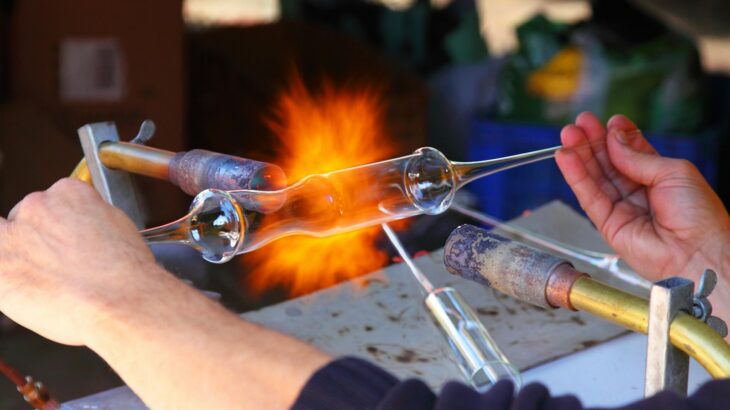 person holding and testing test tube