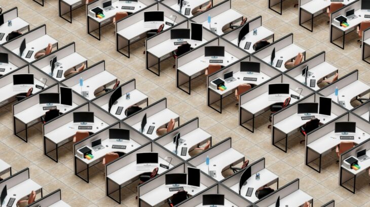 a room filled with lots of desks and computers